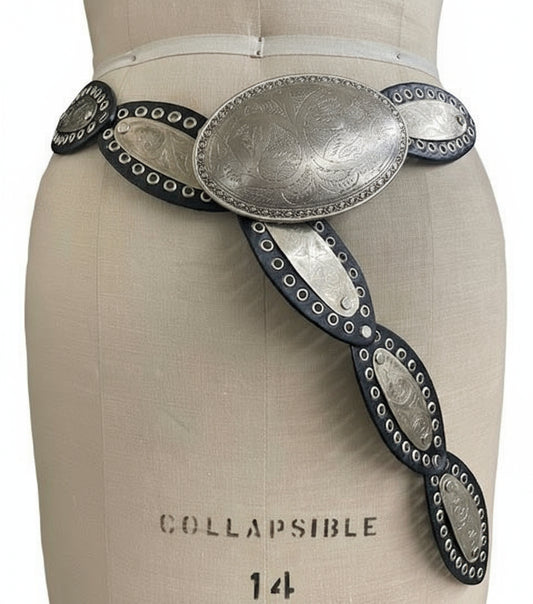 Decorative belt with metallic buckle on a mannequin torso.