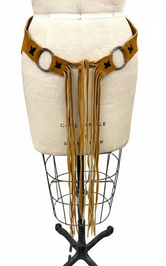 Brown leather fringe belt on a mannequin with a white background