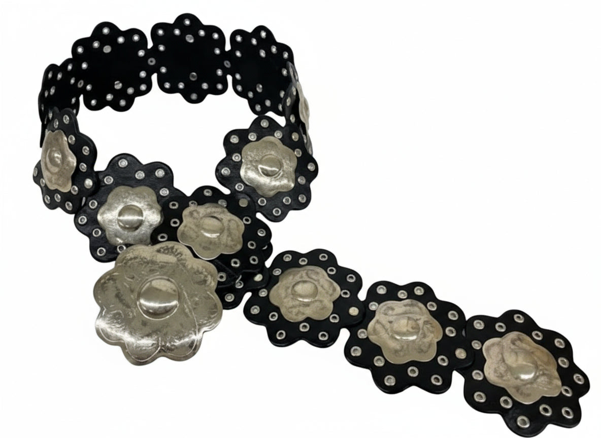 Black and silver floral-patterned belt on a white background