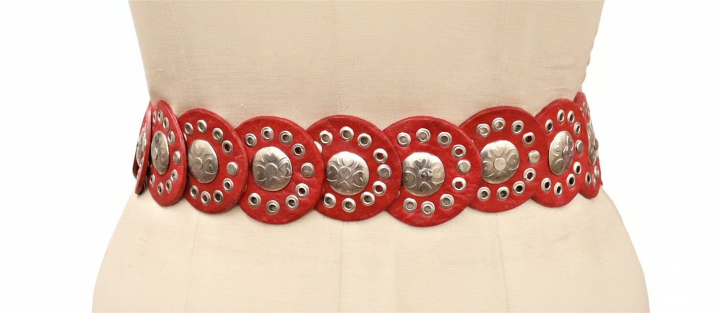 Red belt with silver studs on a mannequin