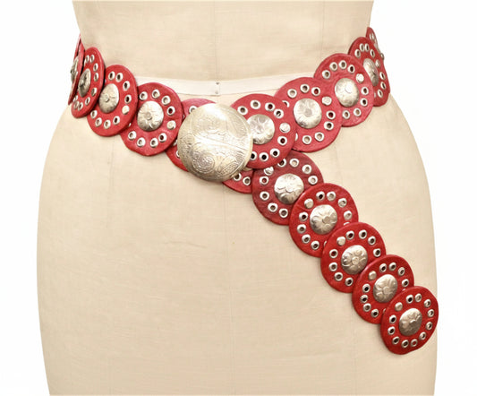 Red belt with silver concho details on a mannequin